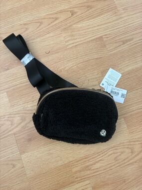 lululemon athletica Black Fleece Belt Bag with Gold Zipper